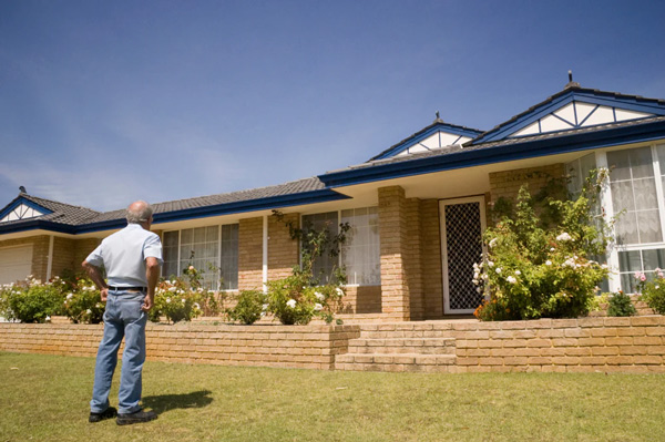 Man looking at house