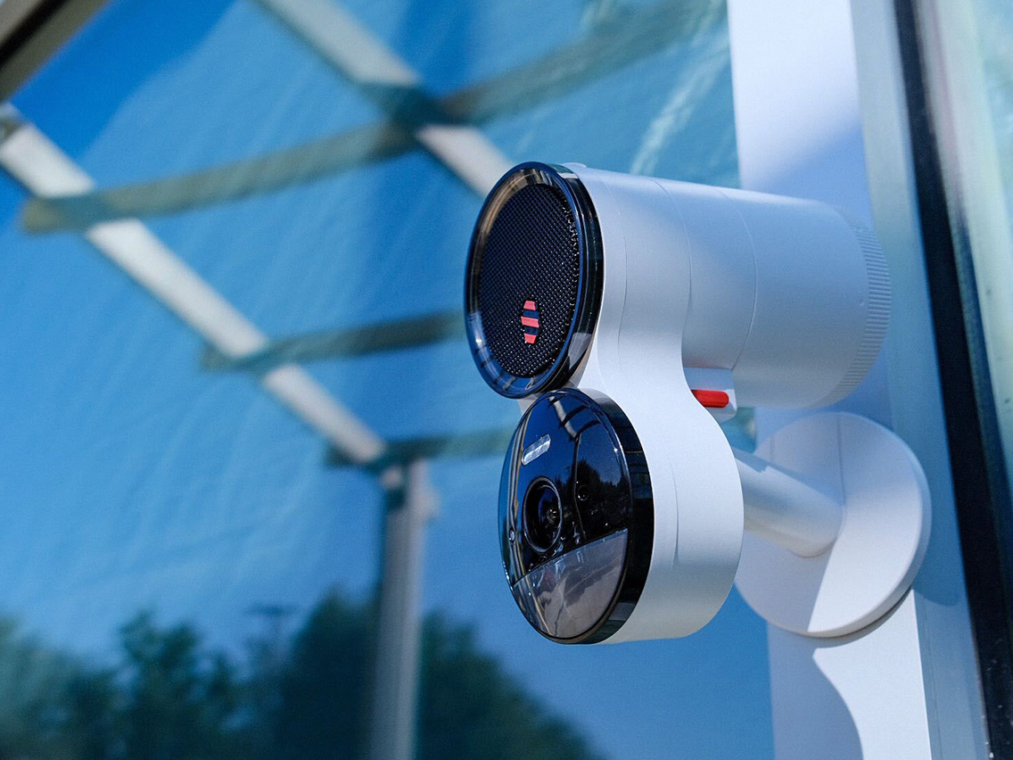 A Deep Sentinel security camera with a speaker attached to it