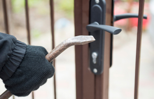 thief with crowbar closeup