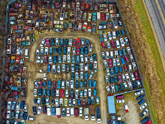 scrap yard overhead with cars