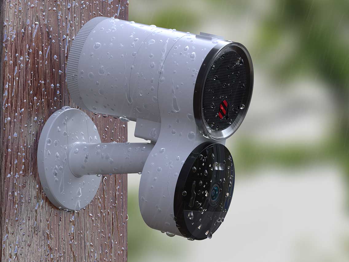 A Deep Sentinel security camera with water drops on it is attached to a wooden post