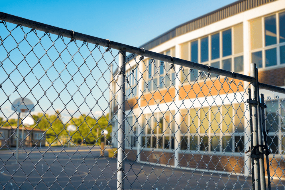 Q&A with School Shooting Expert Tom Czyz - School with fence in foreground