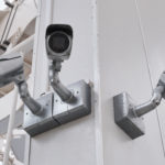 cctv camera security on pole and cement background